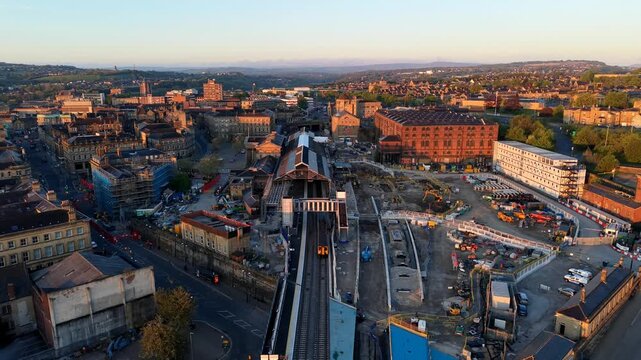 Urban redevelopment and railway platform expansion in Northern England, aerial perspective