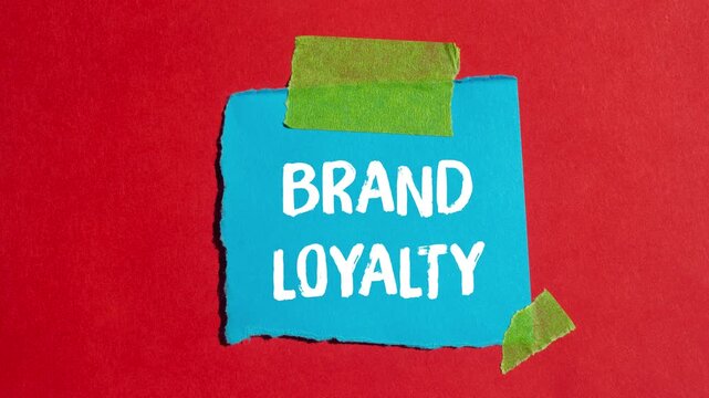 Brand loyalty message written on ripped torn paper background. Conceptual Brand loyalty symbol.