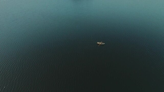 Sail Boat on a Lake in Sweden. Blue Water, Calm Sea. Peaceful Rowing in the Swedish Wilderness. Drone 4K