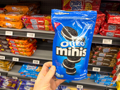 Oreo Minis Cookies Snack Bag Held in Hand in Grocery Store Aisle