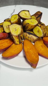 Steamed sweet potato and banana, perfect for breakfast, traditional Indonesian food. Vertical video