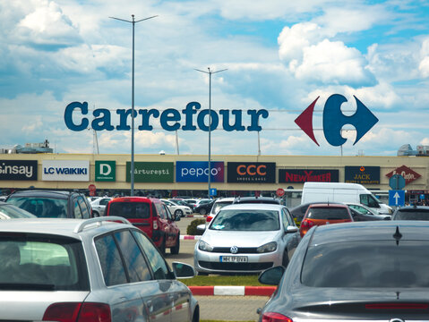 Carrefour chain of stores. Company logo on the supermarket building. Romania, Gorj. May, 02, 2026.