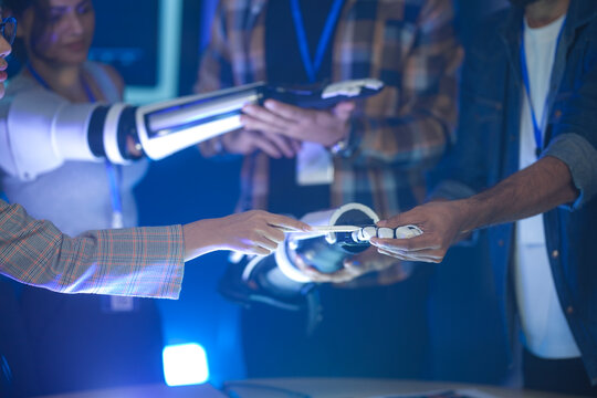 A startup team develops future medical technology. The diverse engineers test a new AI robotic prosthetic, an innovative solution for healthcare and digital transformation.