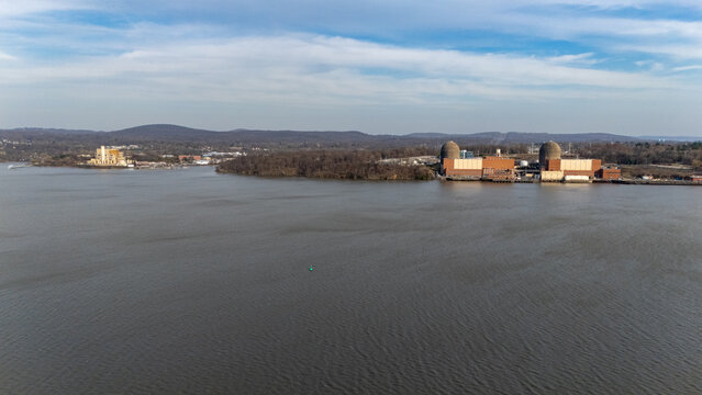 Aerial view of Indian Point Energy Center with its containment domes and industrial buildings along the Hudson River waterfront Buchanan, New York, United States.