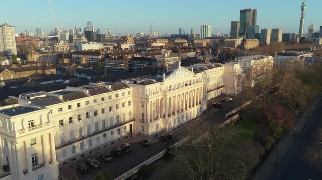 Crown Estate Office in Regent's Park displaying grand regency architecture and terraced houses with cityscape in London, United Kingdom at sunset