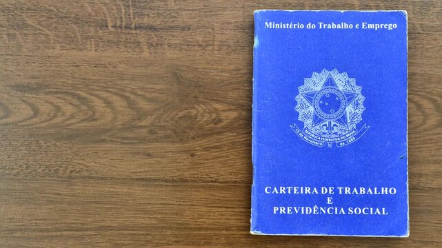 Brazilian work ID on a wooden surface, symbolizing employment and career in the Brazilian context.