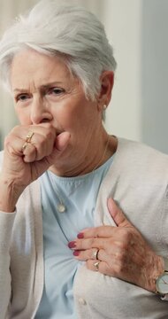 Sick, cough and old woman in home with chest pain, medical emergency and symptoms for asthma attack. Elderly person, health crisis or respiratory infection in house with flu, virus and lung disease.