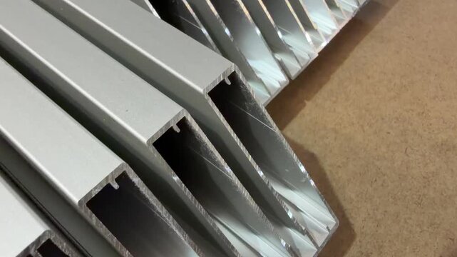 Stacked aluminium profiles demonstrating their versatility and application in modern construction projects.