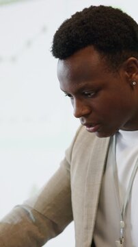 Speaker, man and nervous with sweating in seminar for speech, notes preparation or pressure. Summit event, black person or stress at keynote address for public speaking, presentation or worry in hall
