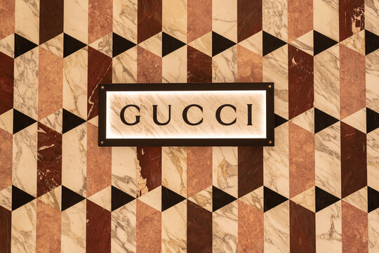 Gucci sign on the colorful wall of a store decorated with a geometric pattern of polygons on January 13, 2024, in Bangkok, Thailand