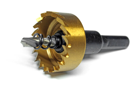  HSS metal hole saw drill bit with titanium coating and ejector spring isolated on white background.