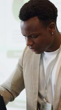 Laptop, speaker and anxiety with sweating in seminar for speech, notes preparation and pressure. Tech, black man and stress at keynote address for public speaking, conference presenter and nervous