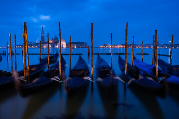 gondolas are parked at venetian canal, italy © jon_chica