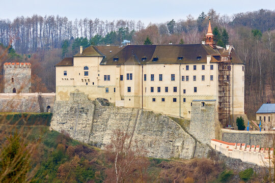 Historic medieval castle with stone walls and towers in a forested landscape. March 15, 2026, Cesky Sternberk, Czech Republic