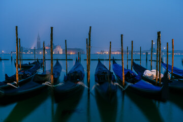 gondolas are parked at venetian canal, italy © jon_chica