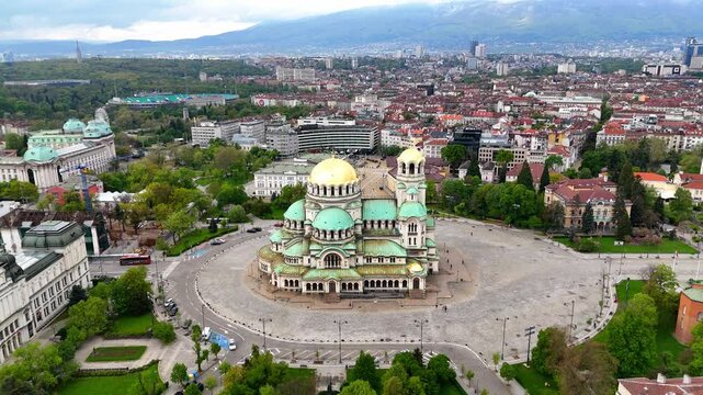 Aerial view of the majestic Alexander Nevsky Cathedral in Sofia. Stunning architecture and vibrant colors. Breathtaking drone view of the cityscape and the cathedral. Bulgaria