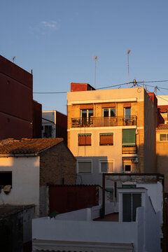 late afternoon golden light on traditional apartment building in Valencia, Spain