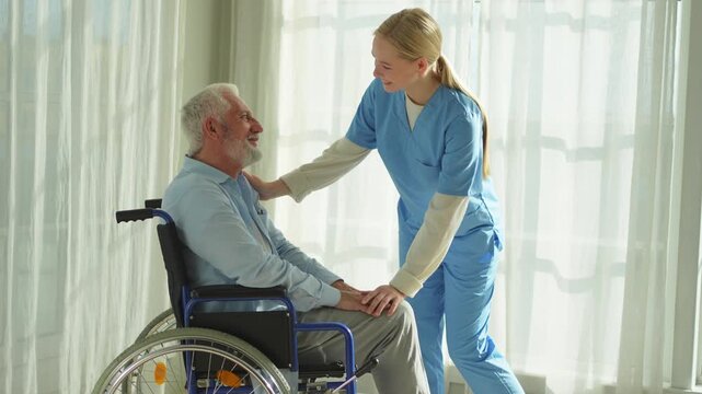 Help support retirement healthcare. Nurse helping old man in wheelchair. Patient and woman in nursing home for medical caregiver. Nurse taking care of paralyzed man in chair for people with disability