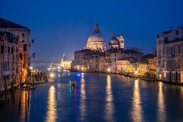 Fototapeta premium views of santa maria della salute basilica from accademia bridge in venice, italy
