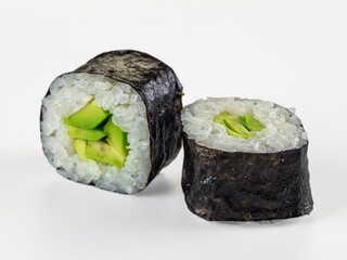 Two fresh avocado maki sushi rolls isolated on a clean white background. © Andrei Starostin