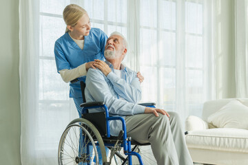 Fototapeta premium Help support retirement healthcare. Nurse helping old man in wheelchair. Patient and woman in nursing home for medical caregiver. Nurse taking care of paralyzed man in chair for people with disability