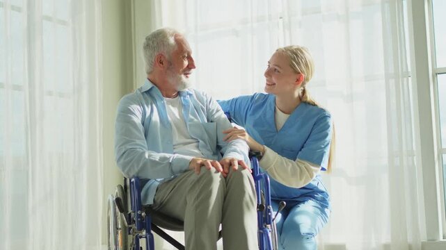 Help support retirement healthcare. Nurse helping old man in wheelchair. Patient and woman in nursing home for medical caregiver. Nurse taking care of paralyzed man in chair for people with disability