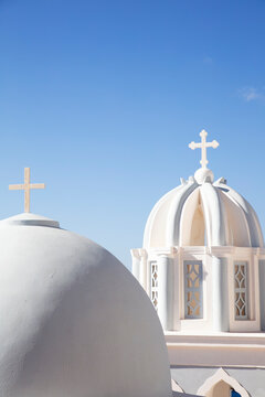 White domes of churches in Santorini Greece