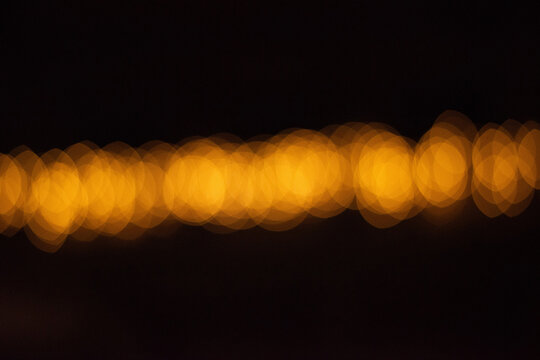 Abstract yellow bokeh lights backround with cops space