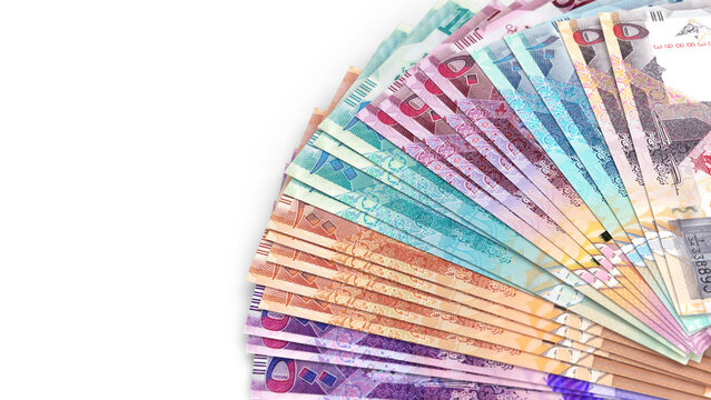 Close-up of Qatari Riyal banknotes fanned out