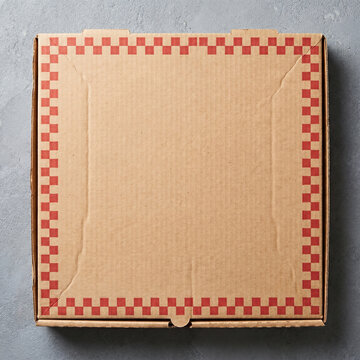 Closed cardboard pizza box with red checkered pattern