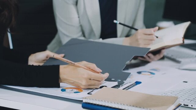 Businessman and Certified Public Accountant (CPA) auditor providing accounting and auditing services in the same company and stock market chart data and anti bribery of accounting