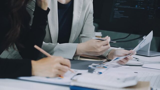 Businessman and Certified Public Accountant (CPA) auditor providing accounting and auditing services in the same company and stock market chart data and anti bribery of accounting