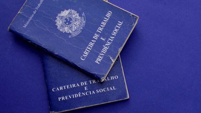 Brazilian work permit on blue surface: professional emblem in stark contrast with the blue background, representing the journey and value of work in Brazil.