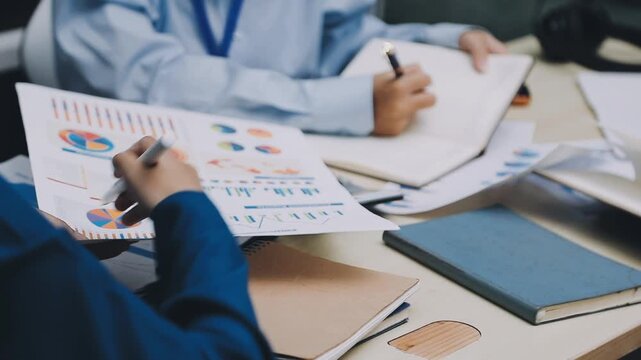 Businessman and Certified Public Accountant (CPA) auditor providing accounting and auditing services in the same company and stock market chart data and anti bribery of accounting