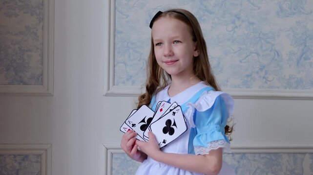Girl With Playing Cards. Elegant Girl Holding Large Playing Cards. Young Woman Displays Oversized Playing Cards Gracefully. Serene Portrait Of Girl With Large Playing Cards And Gentle Lighting