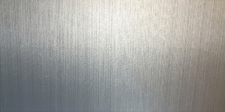 A brushed metal texture background featuring a shiny silver stainless steel surface with a grey metallic plate pattern and textured aluminum material for a sleek gray backdrop wallpaper