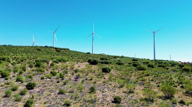 Aerial drone view wind turbines green field renewable energy landscape sustainable power