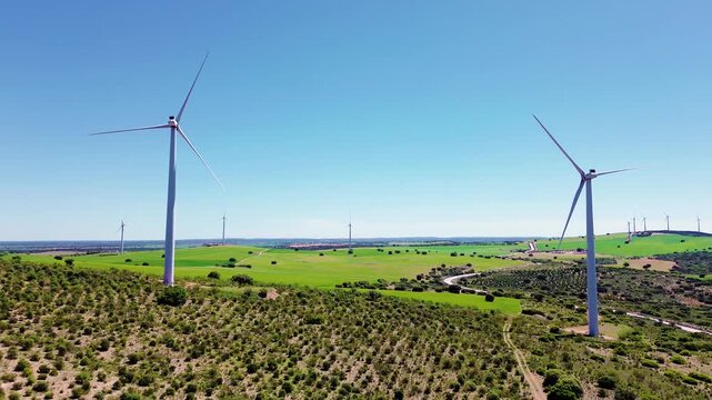 Aerial drone view wind turbines green field renewable energy landscape sustainable power