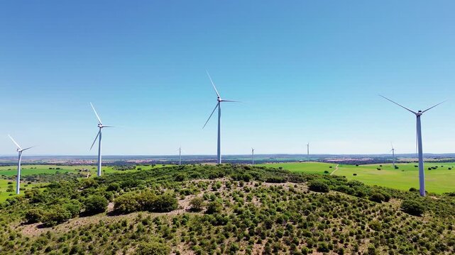Aerial drone view wind turbines green field renewable energy landscape sustainable power