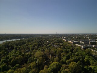 Fototapeta premium Warszawa - Polska - panorama Warszawy wykonana dronem. Rzeka Wisła, kościół, wieżowce, bloki, ulice w słoneczny dzień