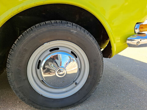 VORONEZH, Russia - April 25, 2026.Detail of Soviet Moskvitch wheel and chrome hubcap with modern Kama tire in sunny weather