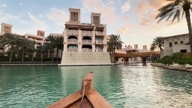 Traditional abra boat ride through Madinat Jumeirah canals, United Arab Emirates