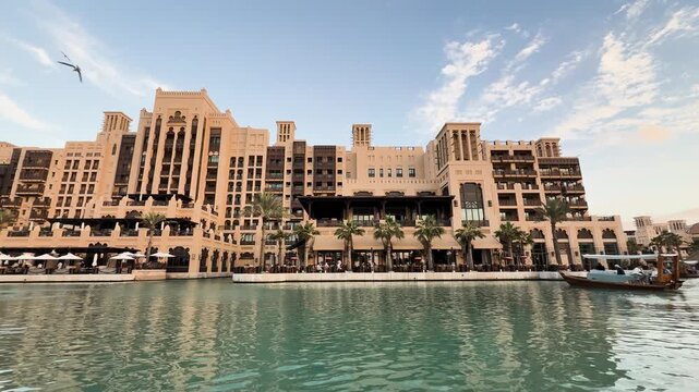 Traditional abra crossing Madinat Jumeirah canals, Dubai, United Arab Emirates
