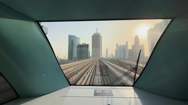 View from front of metro train in Dubai at sunset, United Arab Emirates