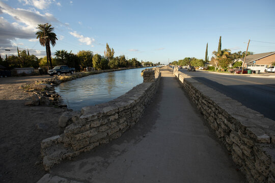 Sunset view of a bridge over an irrigation canal in downtown Dos Palos, Caliofrnia, USA.
