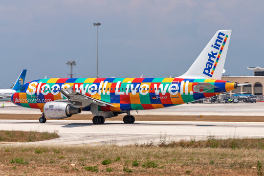 Luqa, Malta - June 5, 2007: Germanwings Airbus A319-112 (REG: D-AKNF) in Park Inn special livery taking off from runway 32 in the midday heat and sun.