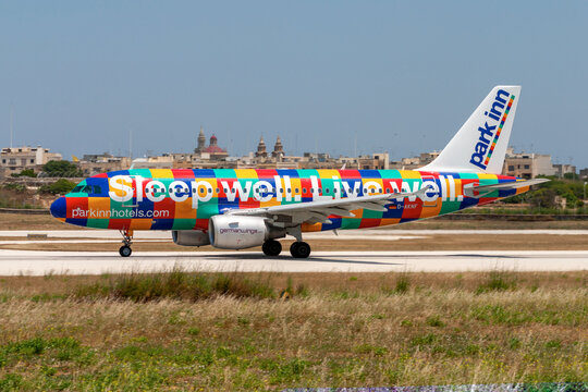 Luqa, Malta - June 5, 2007: Germanwings Airbus A319-112 (REG: D-AKNF) in Park Inn special livery taking off from runway 32 in the midday heat and sun.