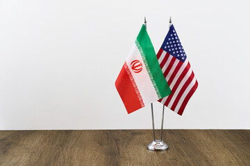 Usa and iran flags symbolizing diplomatic relations and ongoing negotiations