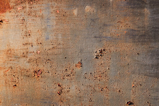 Rusty metal surface texture, orange corrosion on brown iron plate background