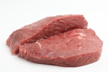 Obraz premium Pieces of raw beef meat on white background